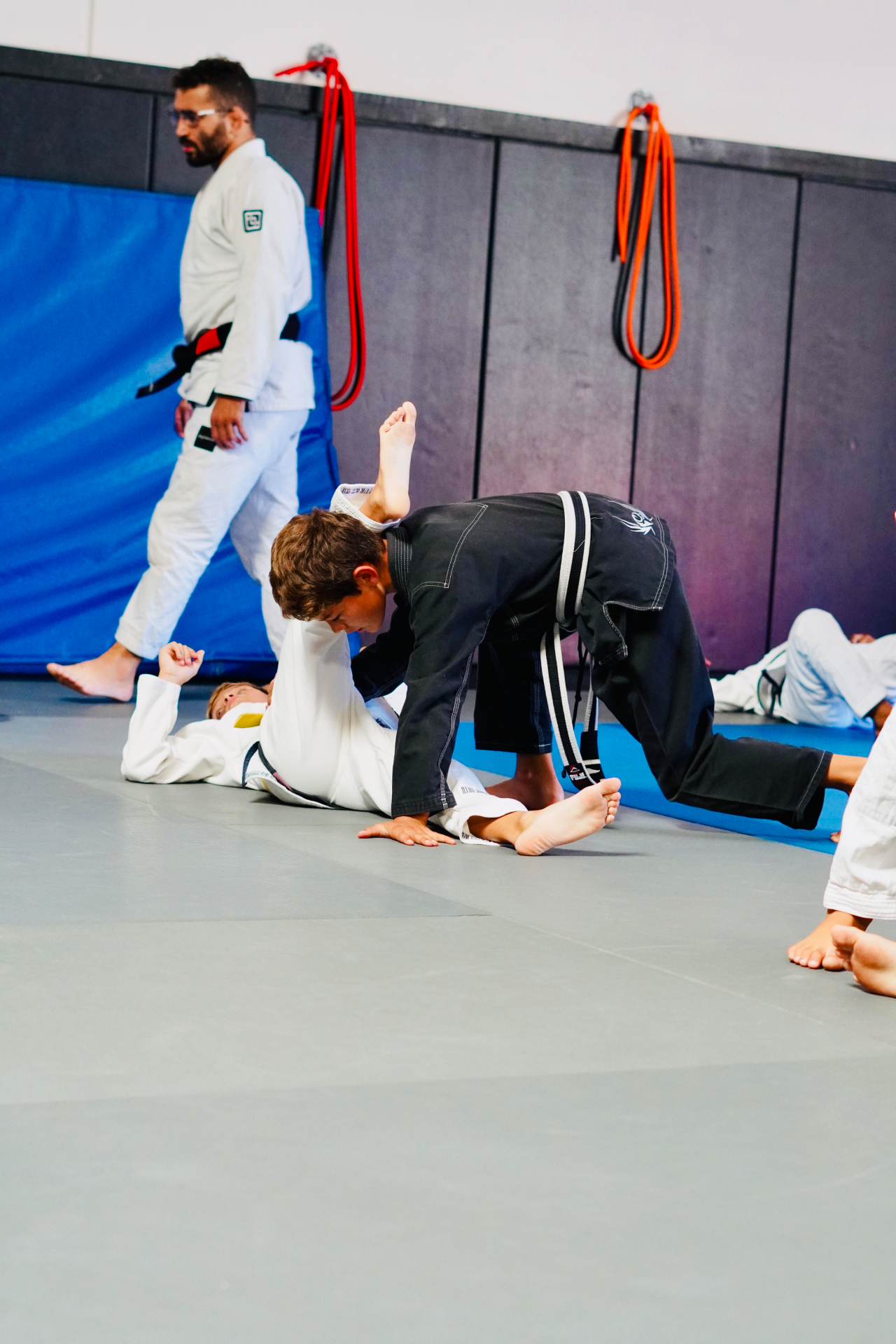 GDA youth athlete passing to side control during a live competition round