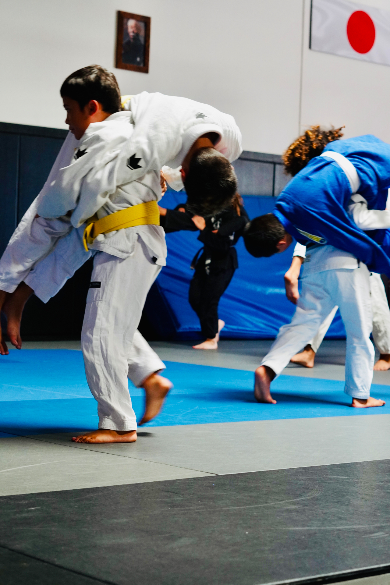 GDA youth athletes drilling takedowns during a training session in San Diego
